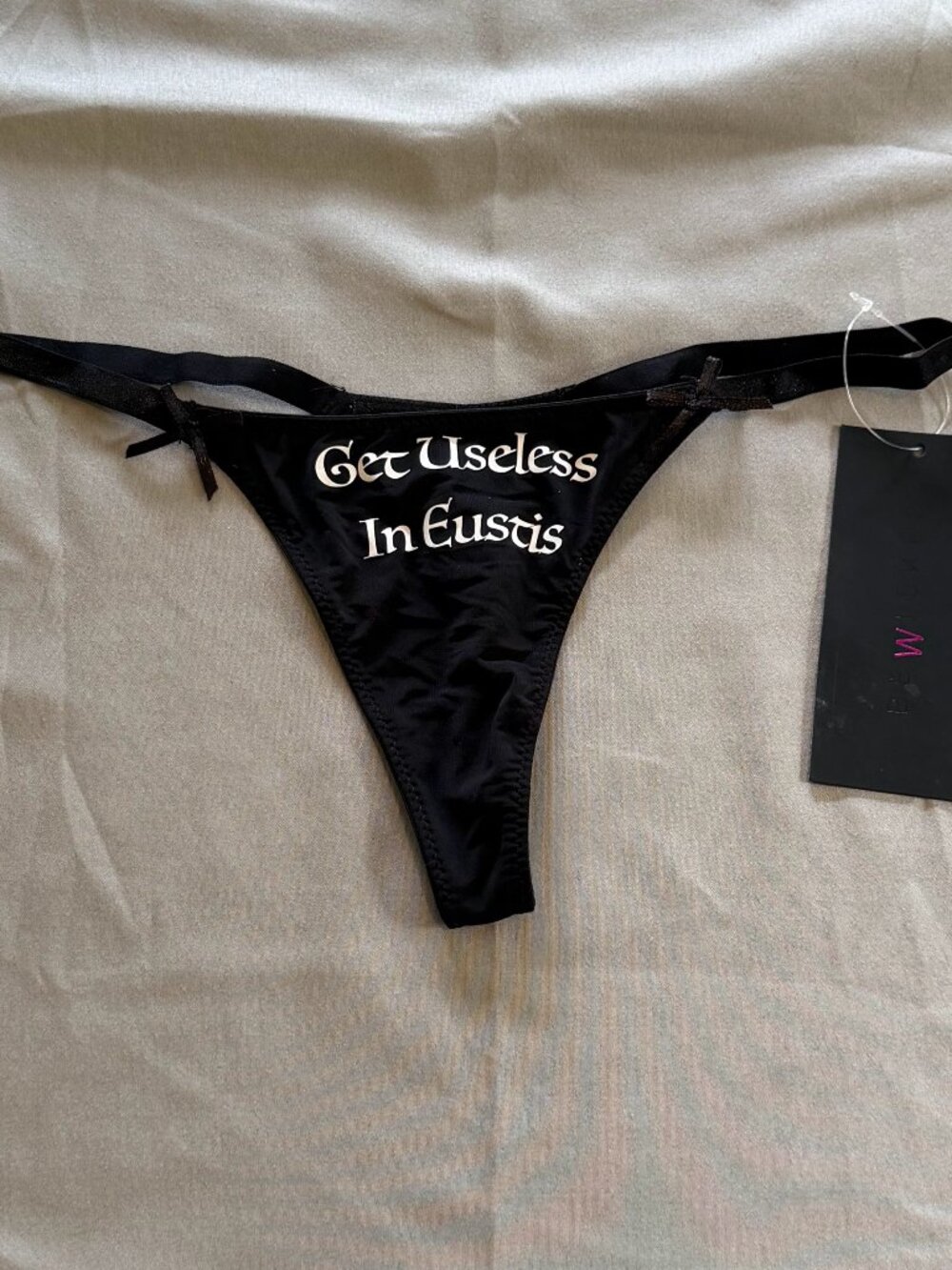 Woman’s New With Tags BeWicked Thong Black Size Small with Vinyl Decal & Bow